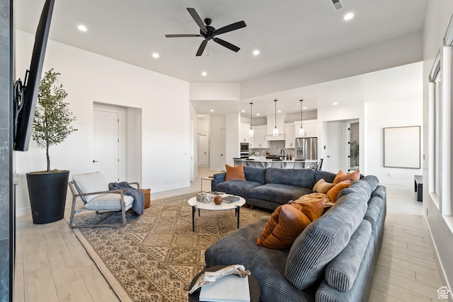 423 W Fitness Way, Ivins, UT 84738 - living area with a ceiling fan, recessed lighting, and light wood-type flooring
