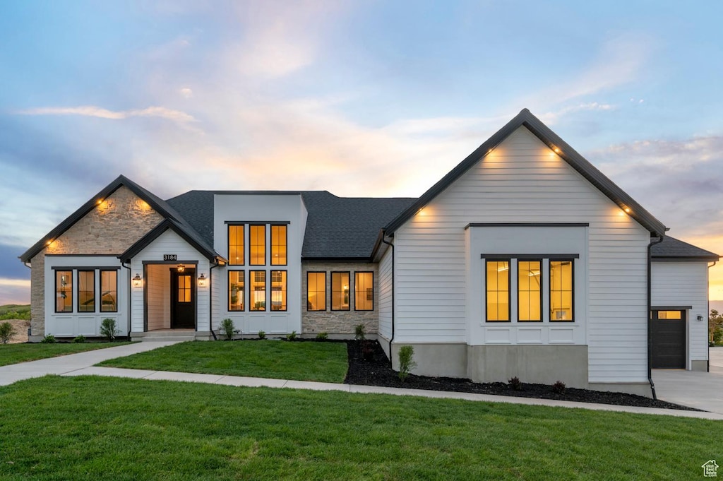 3184 S Dove Dr, Mapleton, UT 84664 - modern farmhouse with a lawn, a garage, and driveway