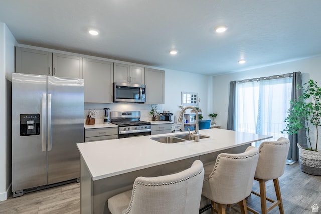 634 W Parker Pl Unit 1060, Grantsville, UT 84029 - kitchen featuring stainless steel appliances, a sink, gray cabinetry, light wood-type flooring, and recessed lighting