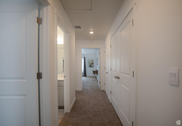 634 W Parker Pl Unit 1060, Grantsville, UT 84029 - corridor featuring light carpet, baseboards, and recessed lighting
