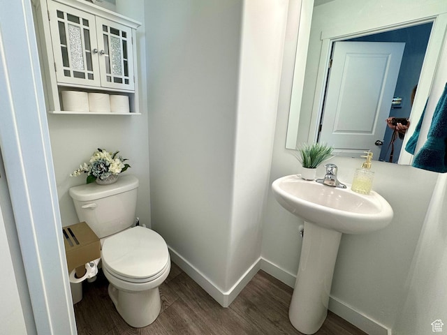 634 W Parker Pl Unit 1060, Grantsville, UT 84029 - bathroom featuring wood finished floors, toilet, and baseboards