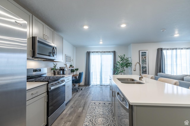 634 W Parker Pl Unit 1060, Grantsville, UT 84029 - kitchen featuring stainless steel appliances, a sink, gray cabinets, light countertops, and recessed lighting