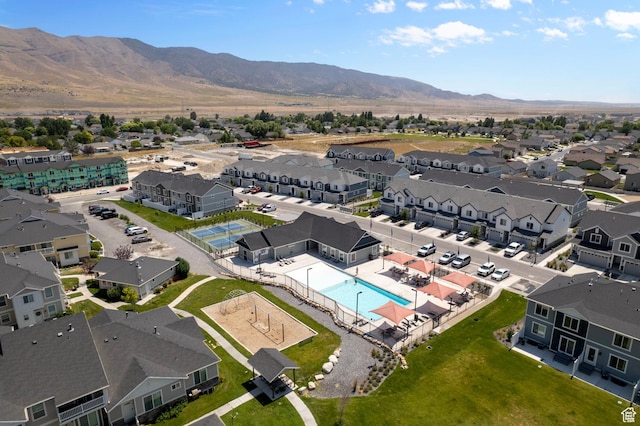 1885 E Thunder Ln Unit 495, Eagle Mountain, UT 84005 - aerial view of residential area with a pool and mountains