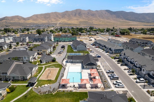 1885 E Thunder Ln Unit 495, Eagle Mountain, UT 84005 - aerial perspective of suburban area featuring a pool and a mountainous background