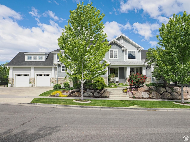 13772 S Kennington Ct E, Draper, UT 84020 - craftsman-style house with stone siding, covered porch, concrete driveway, and a garage