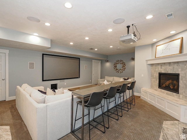13772 S Kennington Ct E, Draper, UT 84020 - carpeted home theater featuring recessed lighting, baseboards, and a fireplace with raised hearth