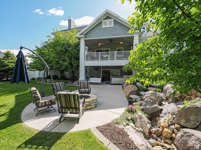 13772 S Kennington Ct E, Draper, UT 84020 - rear view of property with a fire pit, ceiling fan, a patio area, a lawn, and a balcony