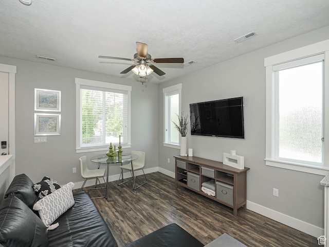 13772 S Kennington Ct E, Draper, UT 84020 - living room with wood finished floors, a ceiling fan, baseboards, plenty of natural light, and a textured ceiling