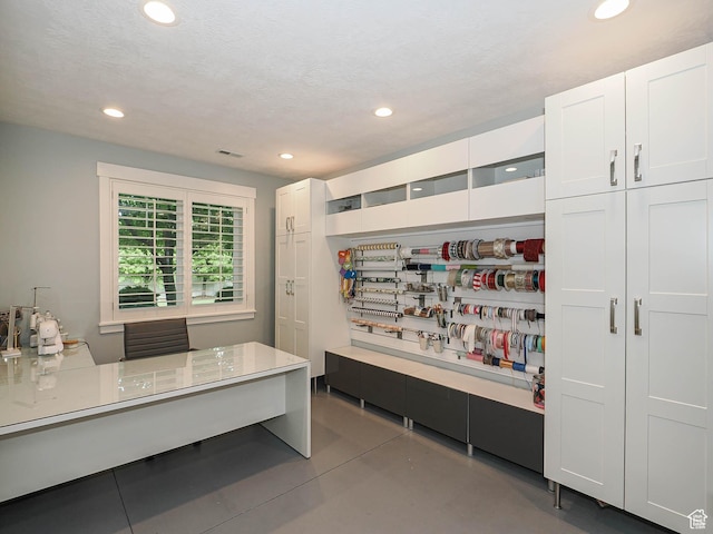 13772 S Kennington Ct E, Draper, UT 84020 - interior space featuring recessed lighting, white cabinetry, concrete flooring, and light countertops