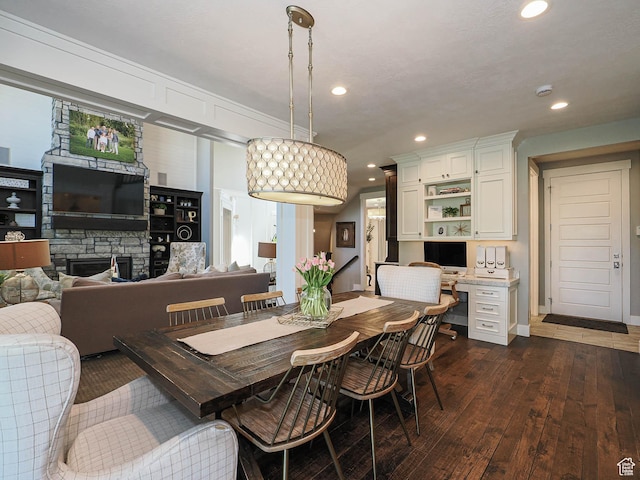 13772 S Kennington Ct E, Draper, UT 84020 - dining space with dark wood finished floors, recessed lighting, baseboards, and a fireplace