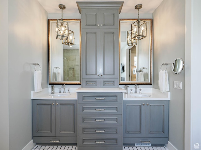 13772 S Kennington Ct E, Draper, UT 84020 - full bath with a chandelier, double vanity, and baseboards