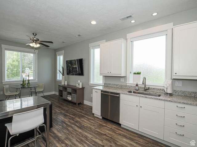 13772 S Kennington Ct E, Draper, UT 84020 - kitchen with dishwasher, a sink, dark wood-style floors, light stone countertops, and baseboards