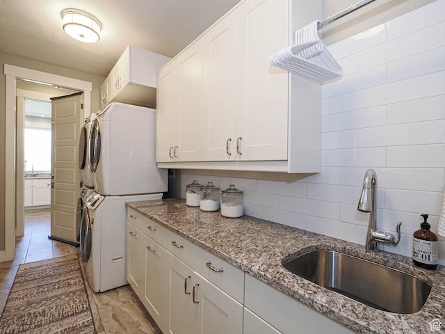 13772 S Kennington Ct E, Draper, UT 84020 - laundry area with stacked washer and clothes dryer and cabinet space
