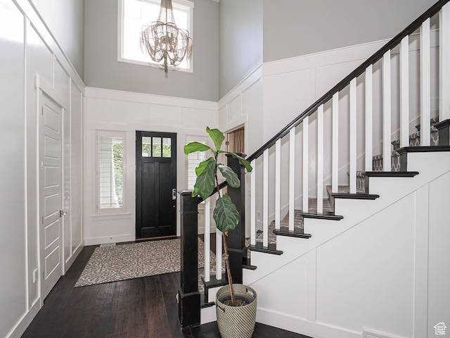 13772 S Kennington Ct E, Draper, UT 84020 - foyer with dark wood finished floors, stairs, a towering ceiling, and a chandelier