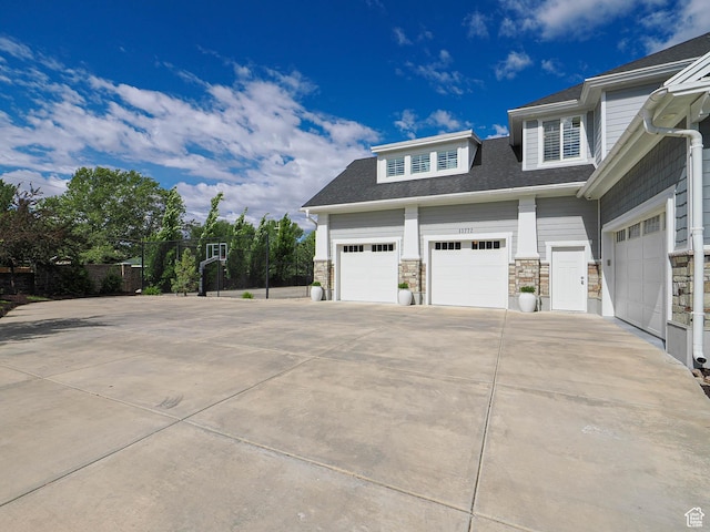 13772 S Kennington Ct E, Draper, UT 84020 - view of property exterior featuring driveway and stone siding