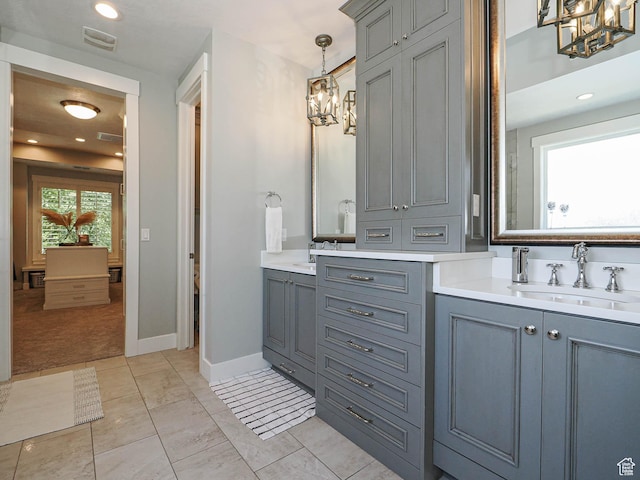 13772 S Kennington Ct E, Draper, UT 84020 - full bathroom with a chandelier, vanity, and baseboards