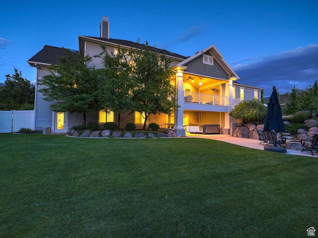 13772 S Kennington Ct E, Draper, UT 84020 - back of property with a balcony, a patio area, a chimney, a gate, and a fire pit