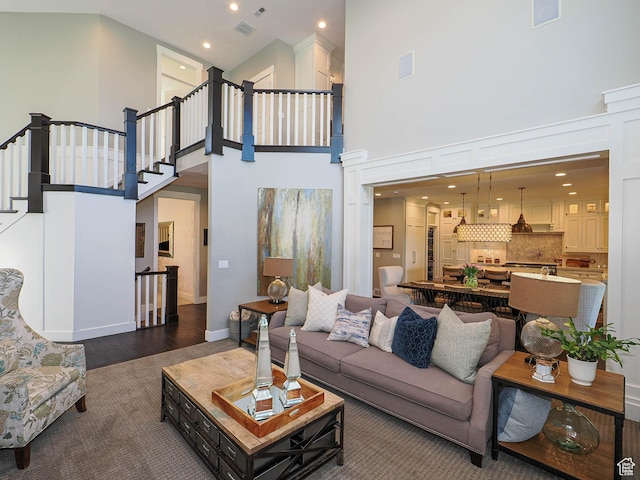 13772 S Kennington Ct E, Draper, UT 84020 - living area with a high ceiling, carpet flooring, stairs, and recessed lighting