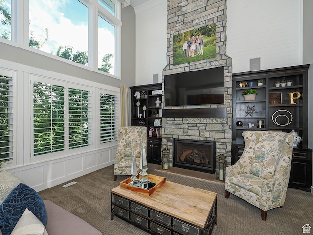 13772 S Kennington Ct E, Draper, UT 84020 - carpeted living room featuring a towering ceiling and a fireplace