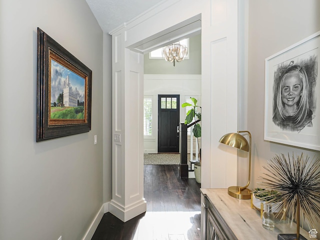 13772 S Kennington Ct E, Draper, UT 84020 - entrance foyer with a chandelier, dark wood-style flooring, and baseboards