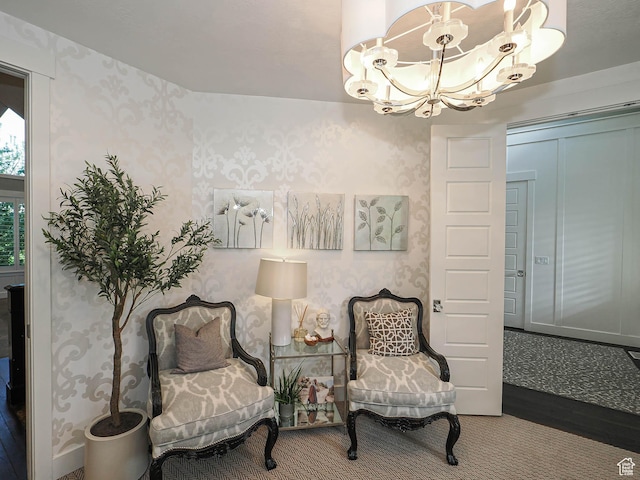 13772 S Kennington Ct E, Draper, UT 84020 - sitting room featuring wallpapered walls, a chandelier, and wood finished floors