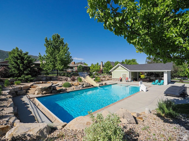 13772 S Kennington Ct E, Draper, UT 84020 - outdoor pool featuring a patio, an exterior structure, an outbuilding, and a water slide