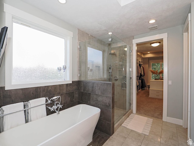 13772 S Kennington Ct E, Draper, UT 84020 - full bath with a freestanding bath, a shower stall, tile patterned flooring, and recessed lighting