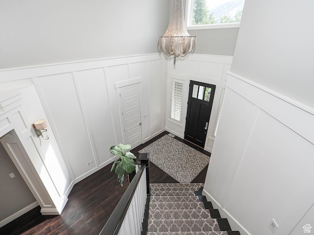 13772 S Kennington Ct E, Draper, UT 84020 - foyer entrance with a decorative wall, a chandelier, wainscoting, and dark wood finished floors