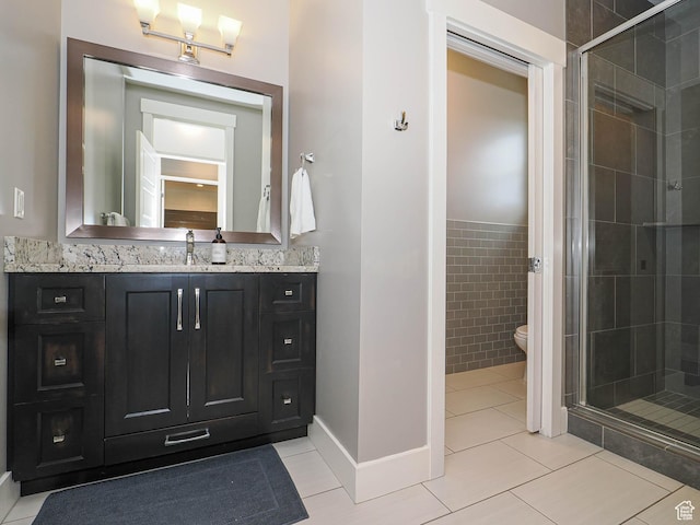 13772 S Kennington Ct E, Draper, UT 84020 - bathroom with vanity, tile patterned flooring, a stall shower, toilet, and wainscoting
