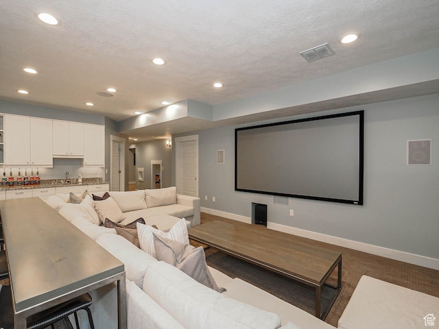 13772 S Kennington Ct E, Draper, UT 84020 - home theater featuring baseboards, recessed lighting, a sink, and a textured ceiling