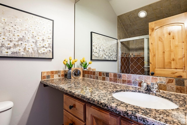 3006 E Canyon Links Dr S, Park City, UT 84098 - bathroom featuring toilet, vanity, a shower stall, and lofted ceiling