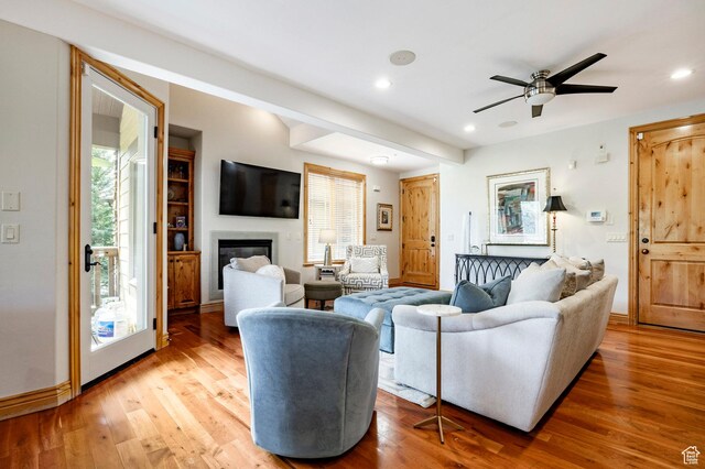 3006 E Canyon Links Dr S, Park City, UT 84098 - living area with wood finished floors, a glass covered fireplace, recessed lighting, a ceiling fan, and baseboards