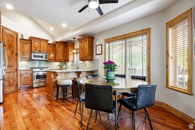 3006 E Canyon Links Dr S, Park City, UT 84098 - dining room featuring lofted ceiling, light wood-style flooring, a ceiling fan, recessed lighting, and baseboards