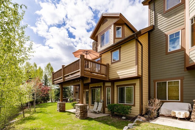 3006 E Canyon Links Dr S, Park City, UT 84098 - rear view of house featuring a patio area, a yard, and a wooden deck
