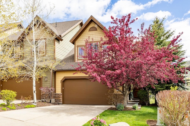 3006 E Canyon Links Dr S, Park City, UT 84098 - view of front of property with a garage, a shingled roof, driveway, and stone siding