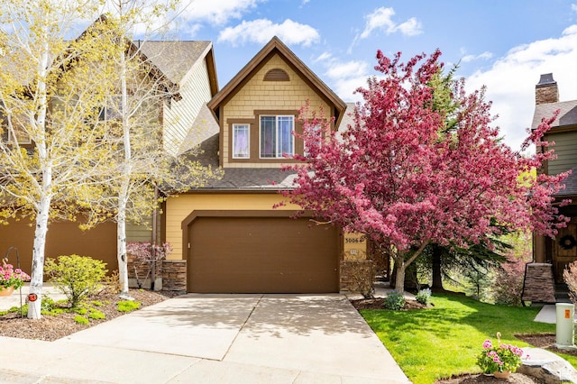 3006 E Canyon Links Dr S, Park City, UT 84098 - craftsman inspired home featuring a garage, stone siding, a front yard, concrete driveway, and roof with shingles