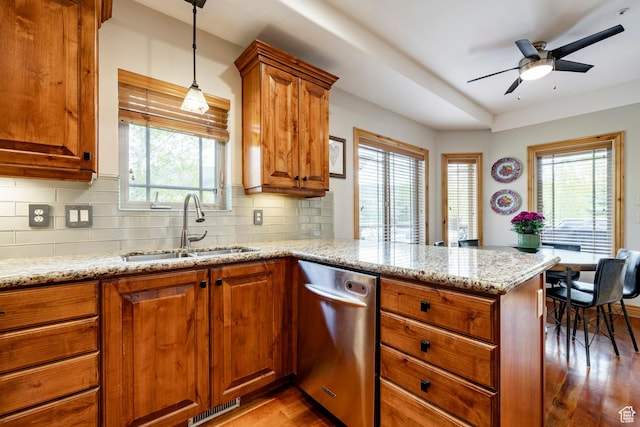 3006 E Canyon Links Dr S, Park City, UT 84098 - kitchen with a sink, dishwasher, a peninsula, wood finished floors, and brown cabinets