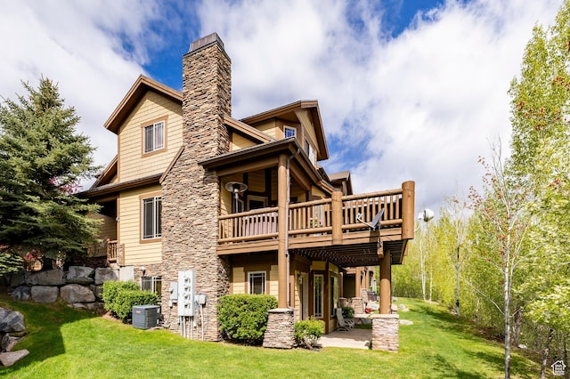 3006 E Canyon Links Dr S, Park City, UT 84098 - rear view of property with central AC, a lawn, a chimney, stone siding, and a wooden deck