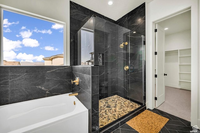 1585 E Black Brush Dr Unit 61, Washington, UT 84780 - bathroom with a bath, a shower stall, a walk in closet, recessed lighting, and tile patterned floors