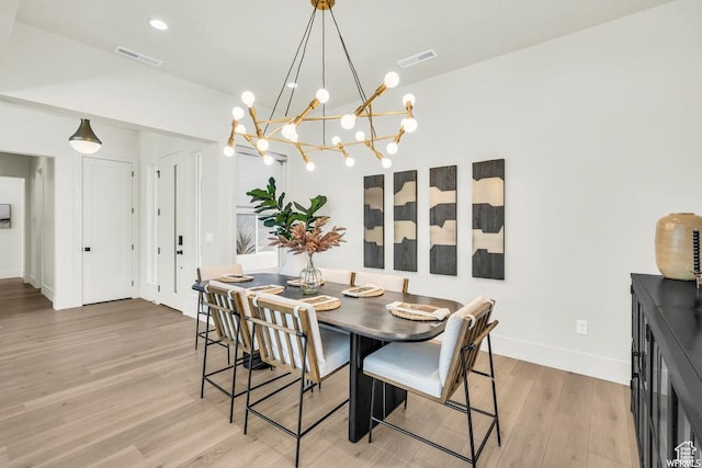 1585 E Black Brush Dr Unit 61, Washington, UT 84780 - dining room with a chandelier, light wood-type flooring, and baseboards