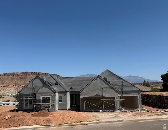 1585 E Black Brush Dr Unit 61, Washington, UT 84780 - property in mid-construction featuring a mountain view, stucco siding, and a garage