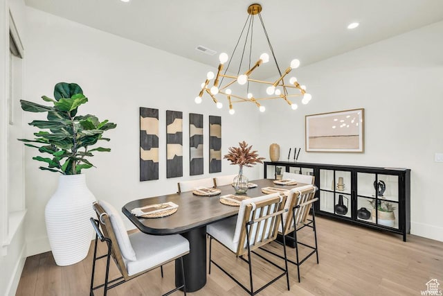 1585 E Black Brush Dr Unit 61, Washington, UT 84780 - dining space with a chandelier, wood finished floors, baseboards, and lofted ceiling