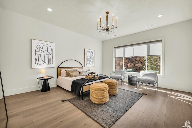 1585 E Black Brush Dr Unit 61, Washington, UT 84780 - bedroom with a chandelier, light wood-style flooring, recessed lighting, and baseboards