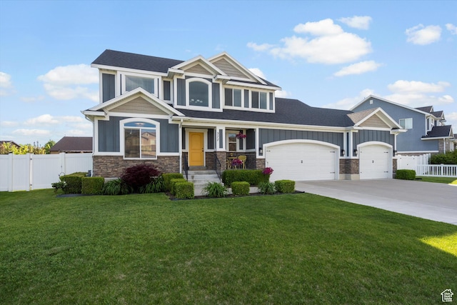 277 N 3600 W, Layton, UT 84041 - craftsman-style house featuring stone siding, an attached garage, board and batten siding, and concrete driveway