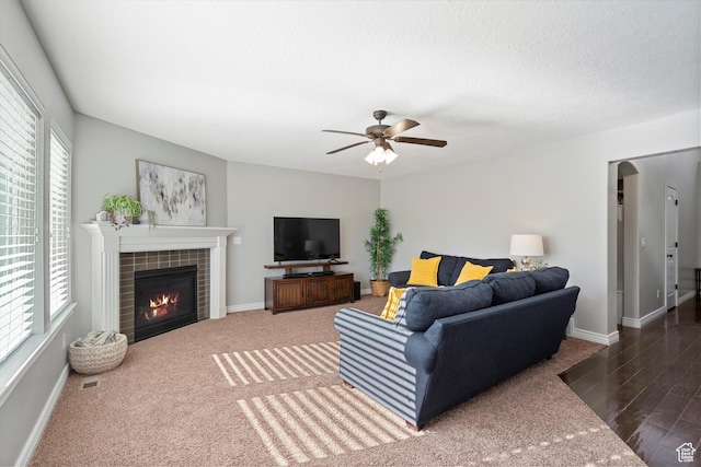 277 N 3600 W, Layton, UT 84041 - carpeted living room featuring a tile fireplace, a ceiling fan, and baseboards