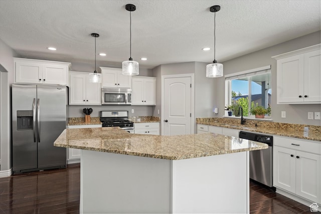 277 N 3600 W, Layton, UT 84041 - kitchen featuring stainless steel appliances, dark wood-style flooring, a sink, a kitchen island, and recessed lighting