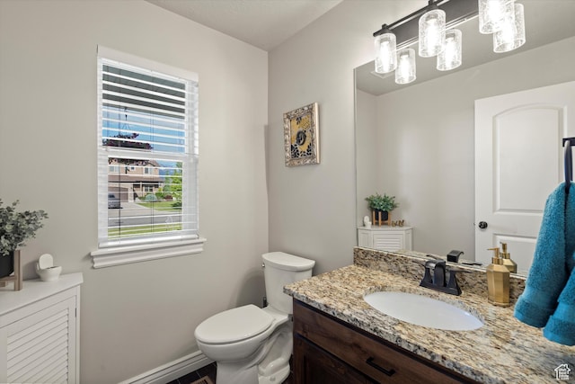 277 N 3600 W, Layton, UT 84041 - half bathroom featuring vanity, toilet, and baseboards