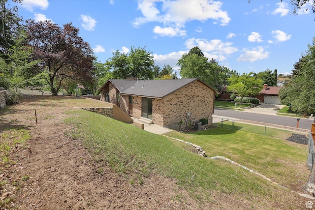 1694 E Plata Way, Sandy, UT 84093 - view of home's exterior with brick siding and cooling unit