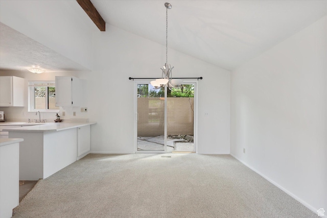 1694 E Plata Way, Sandy, UT 84093 - unfurnished living room with a chandelier, light carpet, beam ceiling, a sink, and baseboards