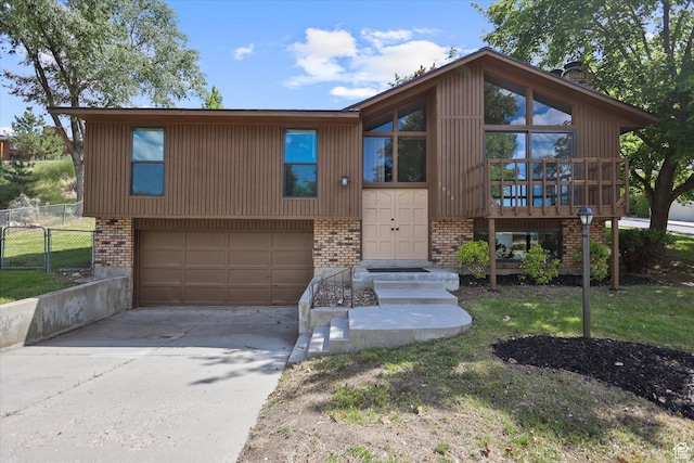 1694 E Plata Way, Sandy, UT 84093 - view of front of home featuring brick siding, a garage, driveway, and a chimney